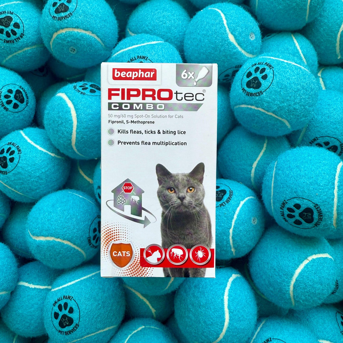 Beaphar Fiprotec Combo packaging with a pile of blue tennis balls featuring paw prints.