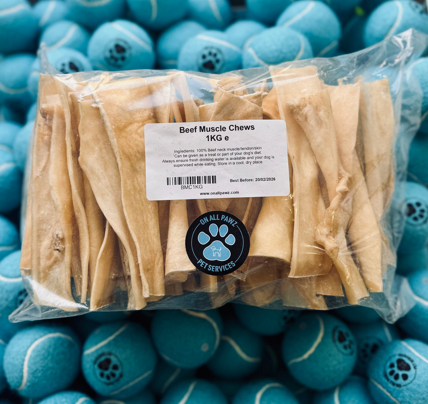 Packaged Beef Muscle Chews dog treat inside a clear plastic bag, with product labeling visible.
