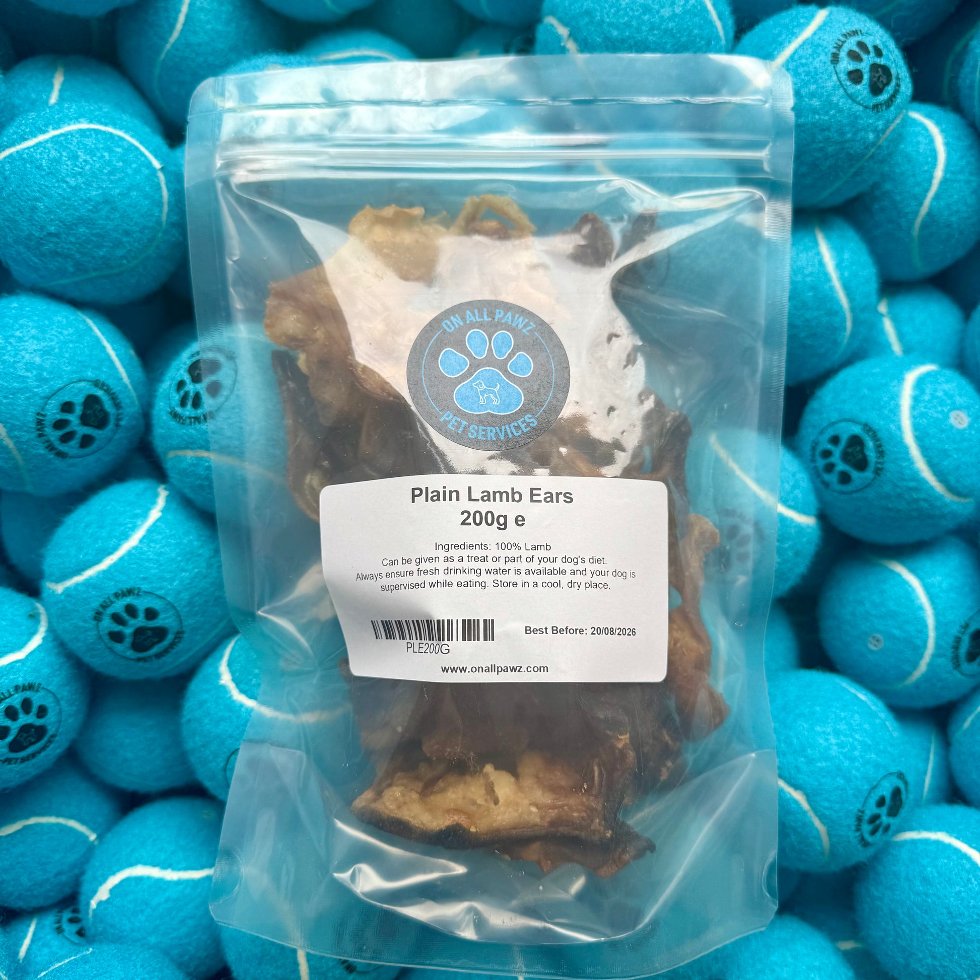 Package of plain lamb ears with a label on a background of blue tennis balls