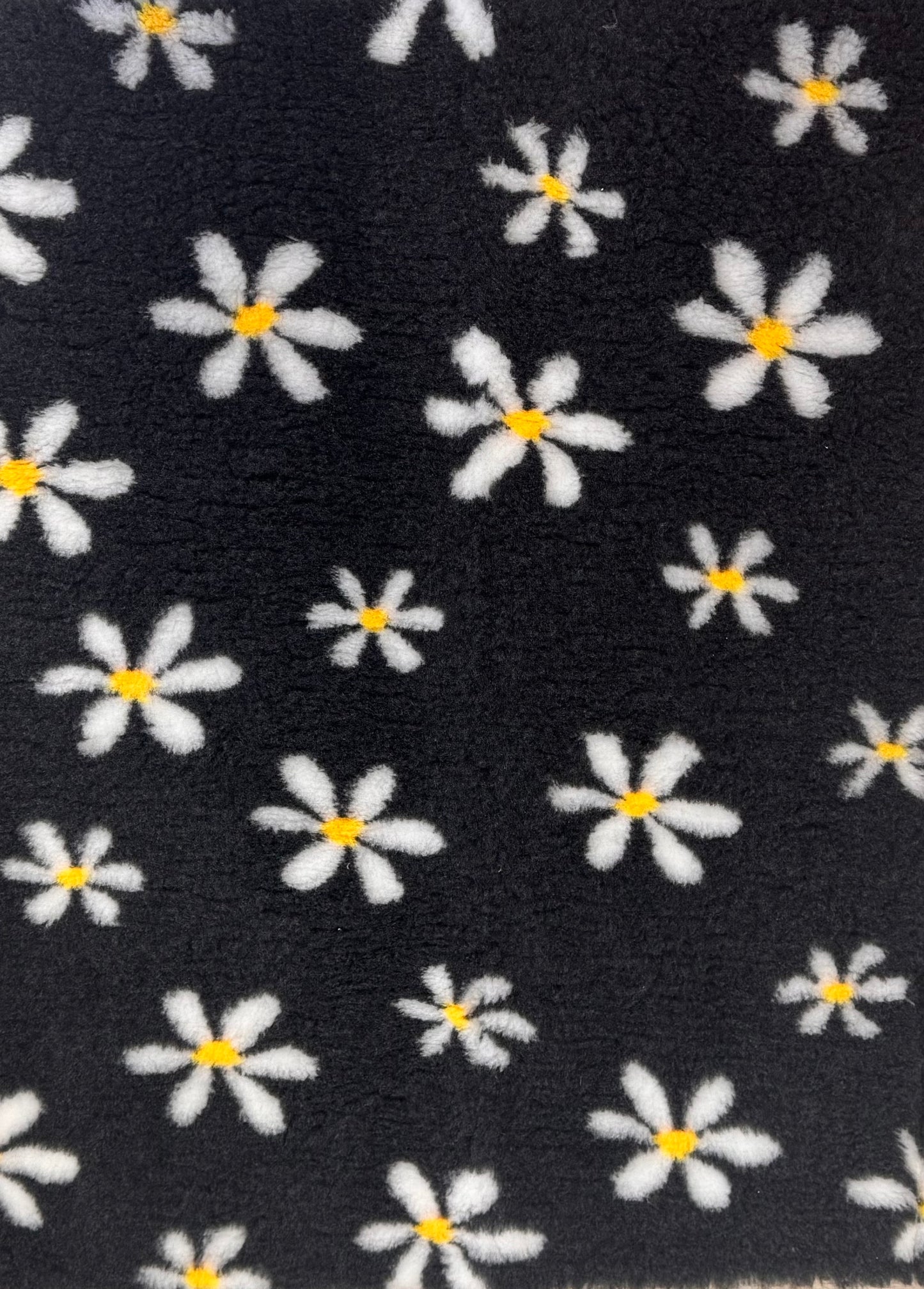 Black vet bedding with a white floral pattern