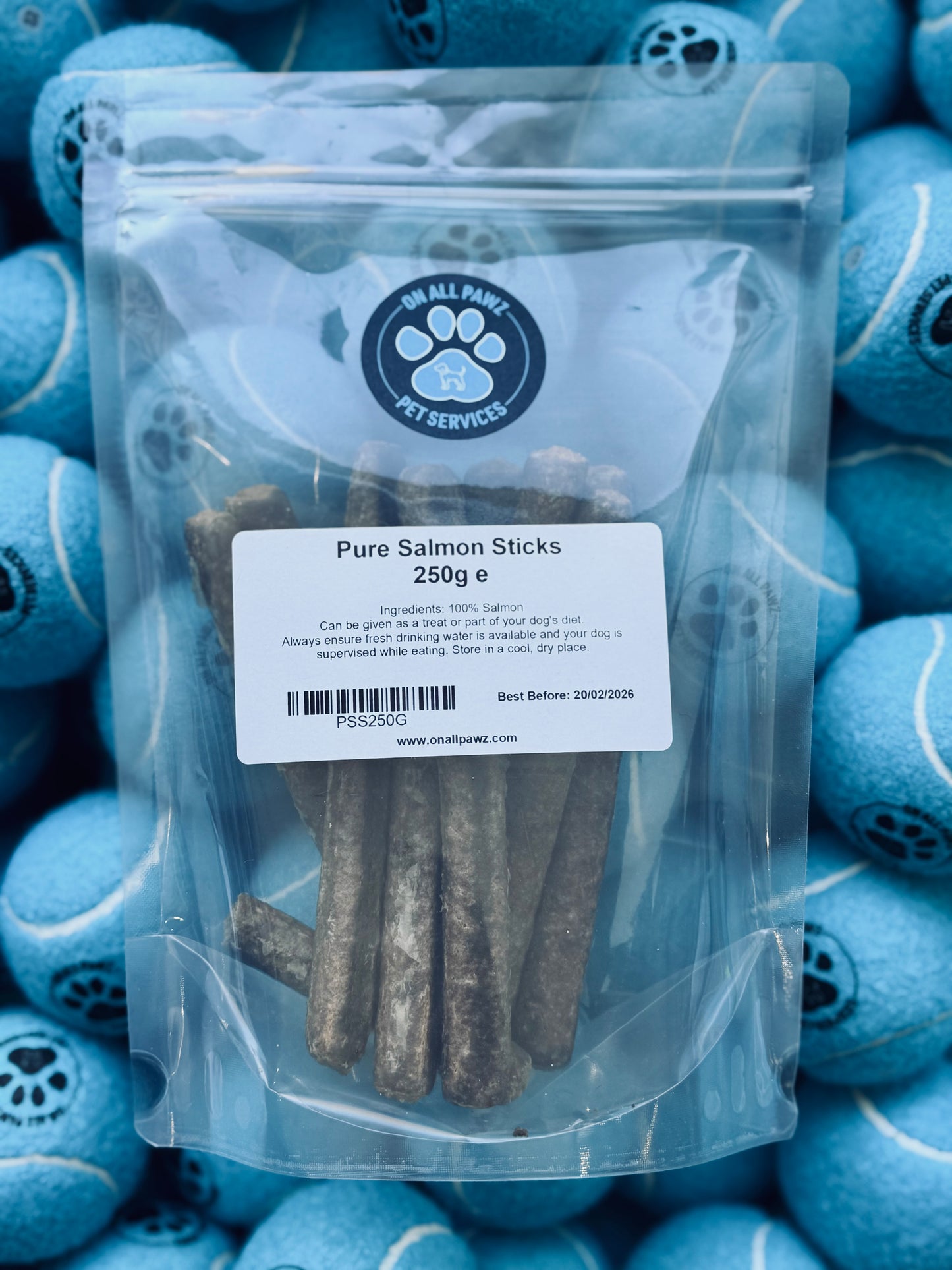 Pack of Pure Salmon Sticks dog treat in resealable packaging, with treats visible through the clear front.
