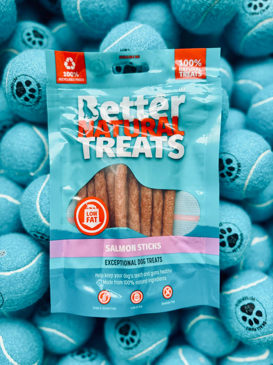 Packaging of Better Natural Treats Salmon Sticks with blue tennis balls in the background