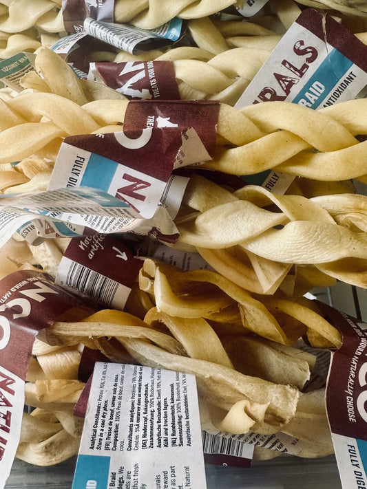 Close-up of braided potato chips with visible brand labels.