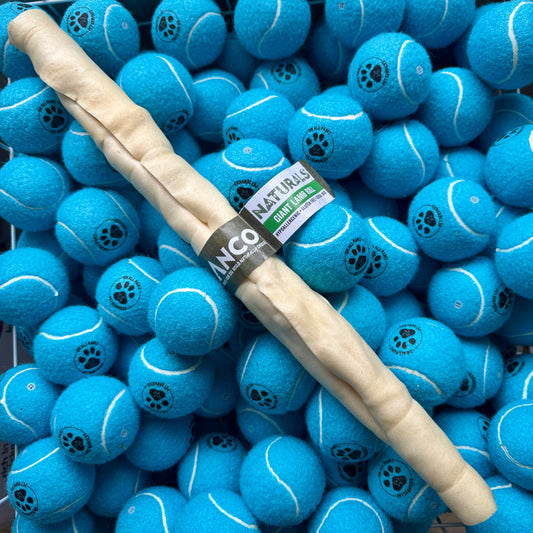 Blue tennis balls with a dog chew stick and a brand label on top
