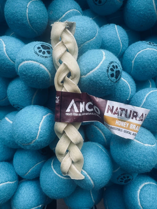 Dog toy with braided handle surrounded by blue tennis balls on a matching background