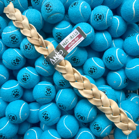 Blue tennis balls with a braided dog toy on top, branded 'ANZO'.