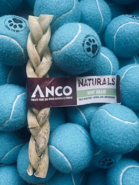 Dog toy with blue tennis balls and a braided rope, branded as 'Anco Naturals'.