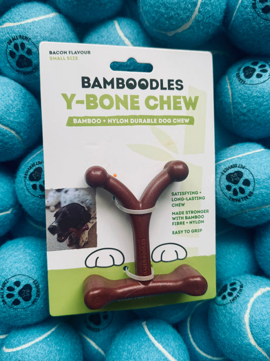 Bamboodles Y-Bone Chew toy packaging with blue tennis balls in the background