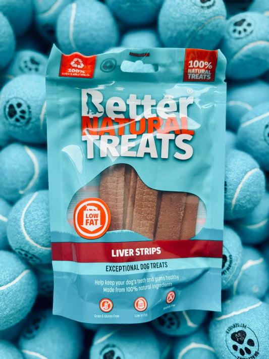 Package of Better Natural Treats Liver Strips for dogs on a background of blue dog toys.