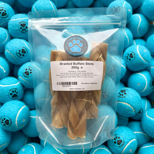 Package of braided buffalo skins with a label on a background of blue tennis balls.