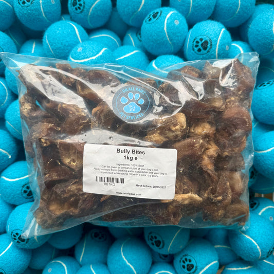 Bag of Bully Bites with a label on a background of blue tennis balls