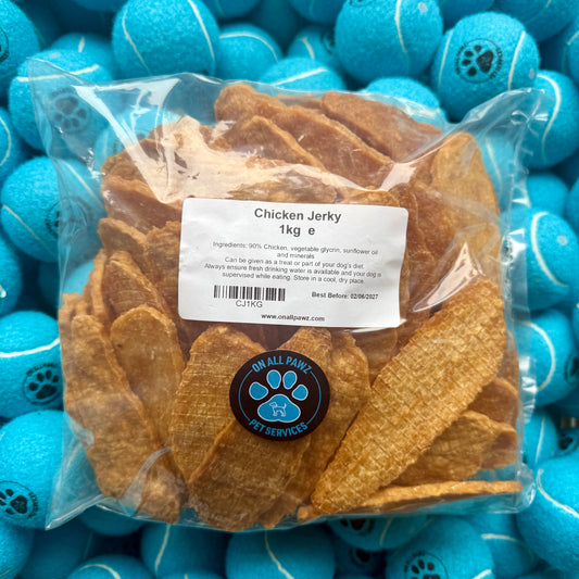 Bag of chicken jerky with a label on blue tennis balls
