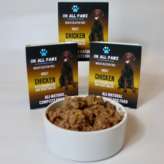 Bowl of dog food with 'On All Pawz' packaging in the background