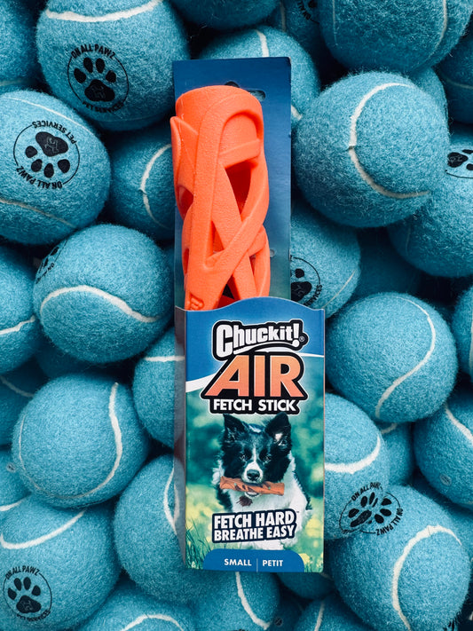 Chuckit! Air Fetch Stick packaging surrounded by blue tennis balls