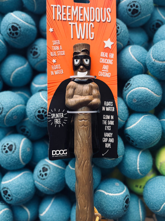 A synthetic dog toy designed to resemble a twig, with a built-in rope for throwing, displayed on a background of tennis balls.