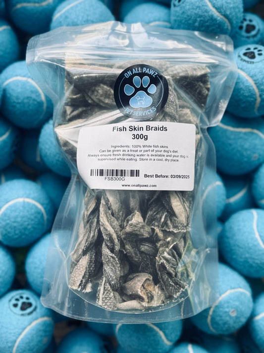 Packaged Fish Skin Braids dog treat in a clear plastic bag with a label, placed on a background with blue dog-shaped objects.