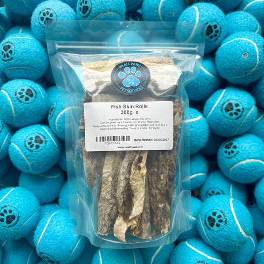 Packaged fish skin rolls with a label on a background of blue tennis balls.