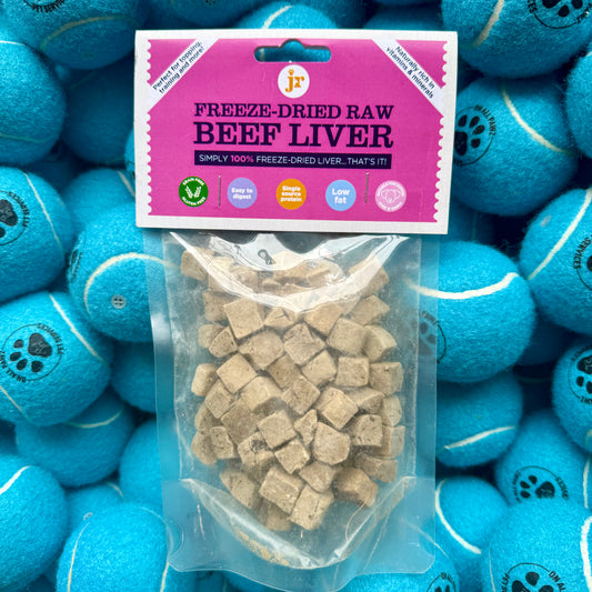 Package of freeze-dried raw beef liver with a background of blue tennis balls