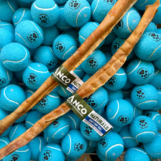 Dog chew toy and blue tennis balls with a brand label on a background of blue tennis balls.