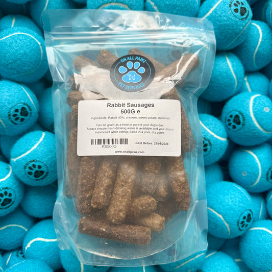 Bag of rabbit sausages with a label on a background of blue tennis balls