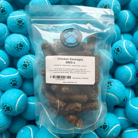 Package of chicken sausages with a label on a background of blue tennis balls