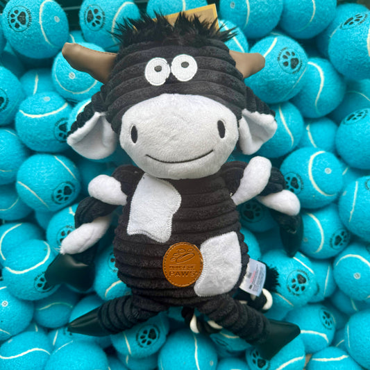 Plush toy with horns and a black outfit surrounded by blue balls