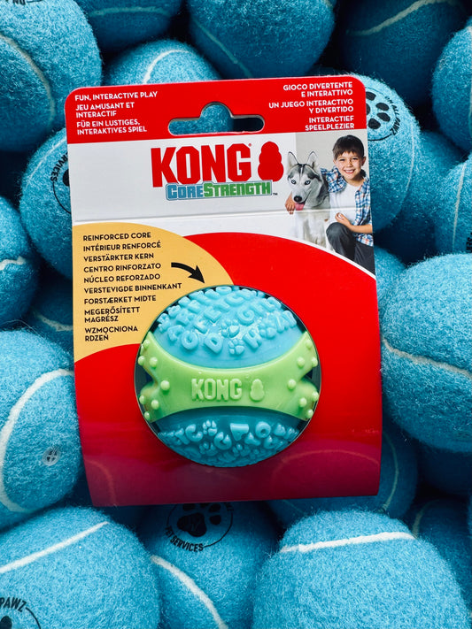 Kong CoreStrength dog toy packaging surrounded by blue KONG balls