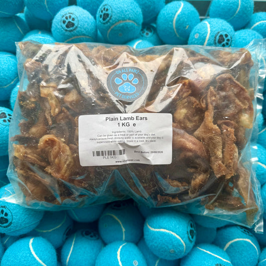 Bag of plain lamb ears for dogs with a label on a background of blue tennis balls.