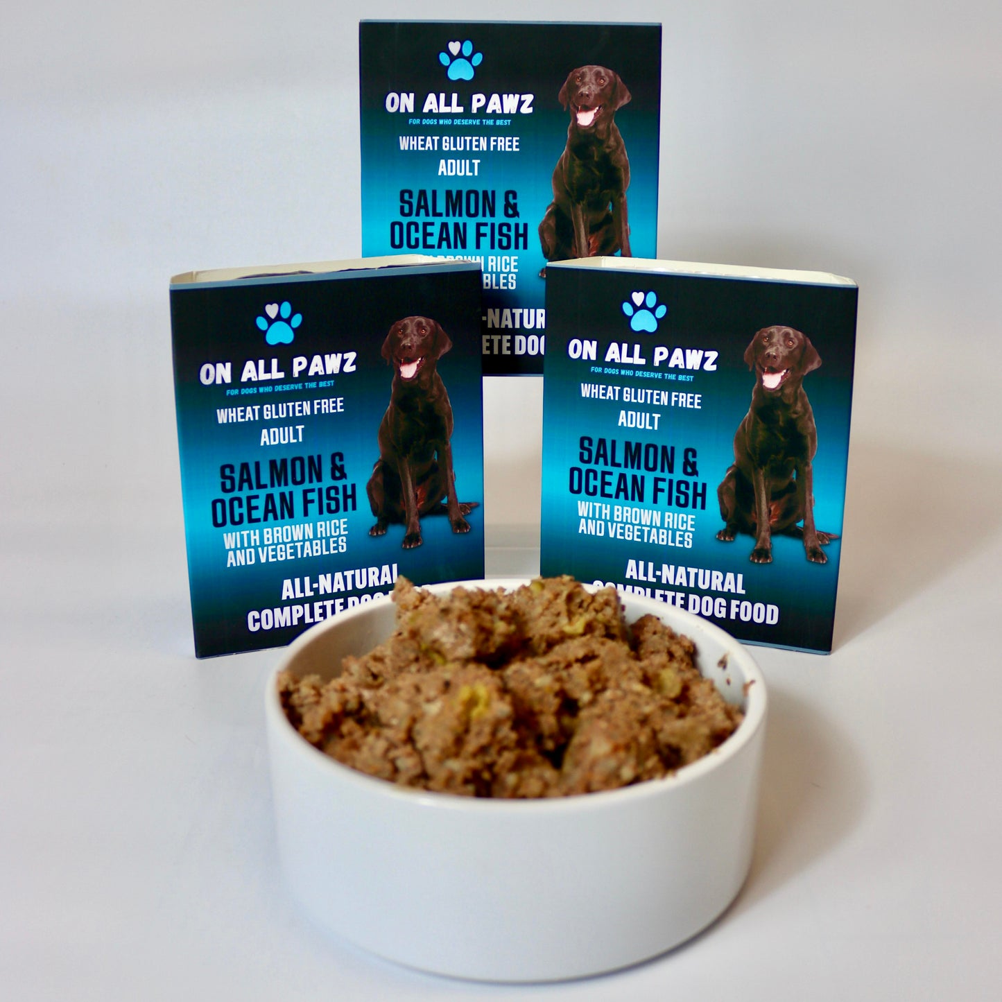 Dog food packaging with a bowl of dog food on a white background