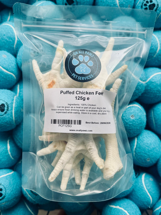 Packed puffed chicken feet with a label on a background of blue balls