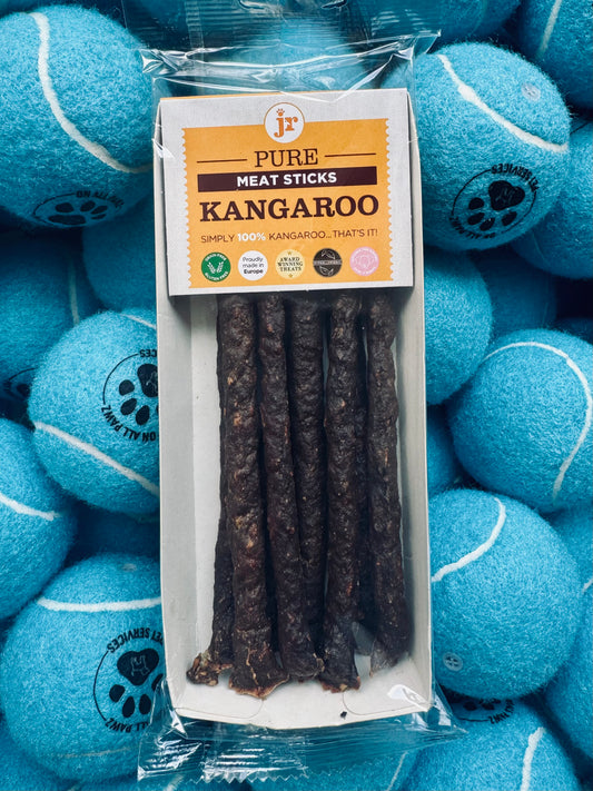 Pack of Pure Meat Sticks Kangaroo with blue tennis balls in the background