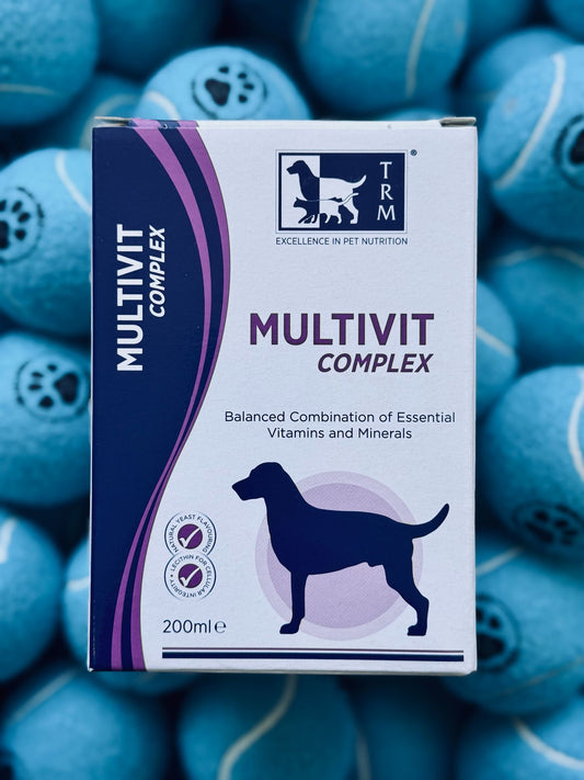 Multivit Complex packaging with a dog silhouette on a background of blue pet toys.